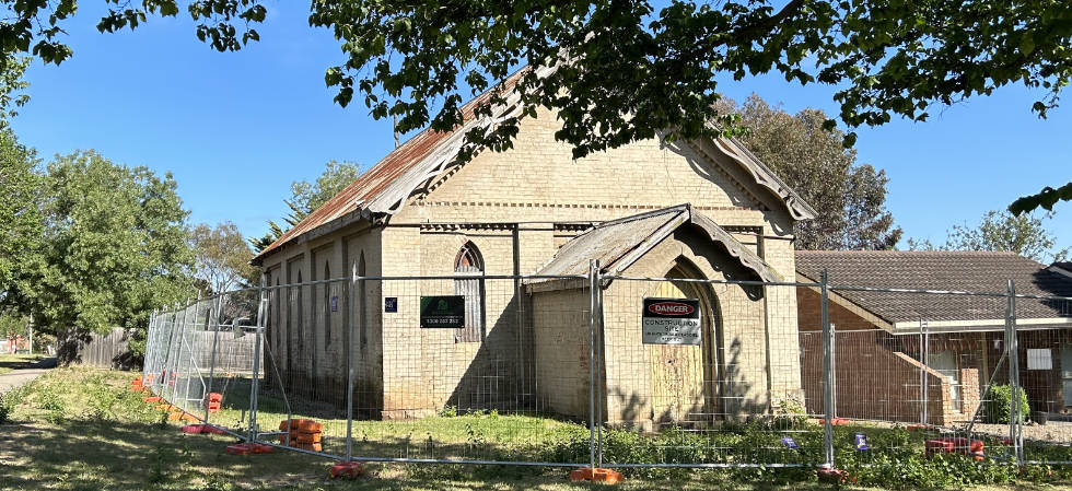 Uniting Church, Barkly Street, Sunbury, surrounded by security fencing.