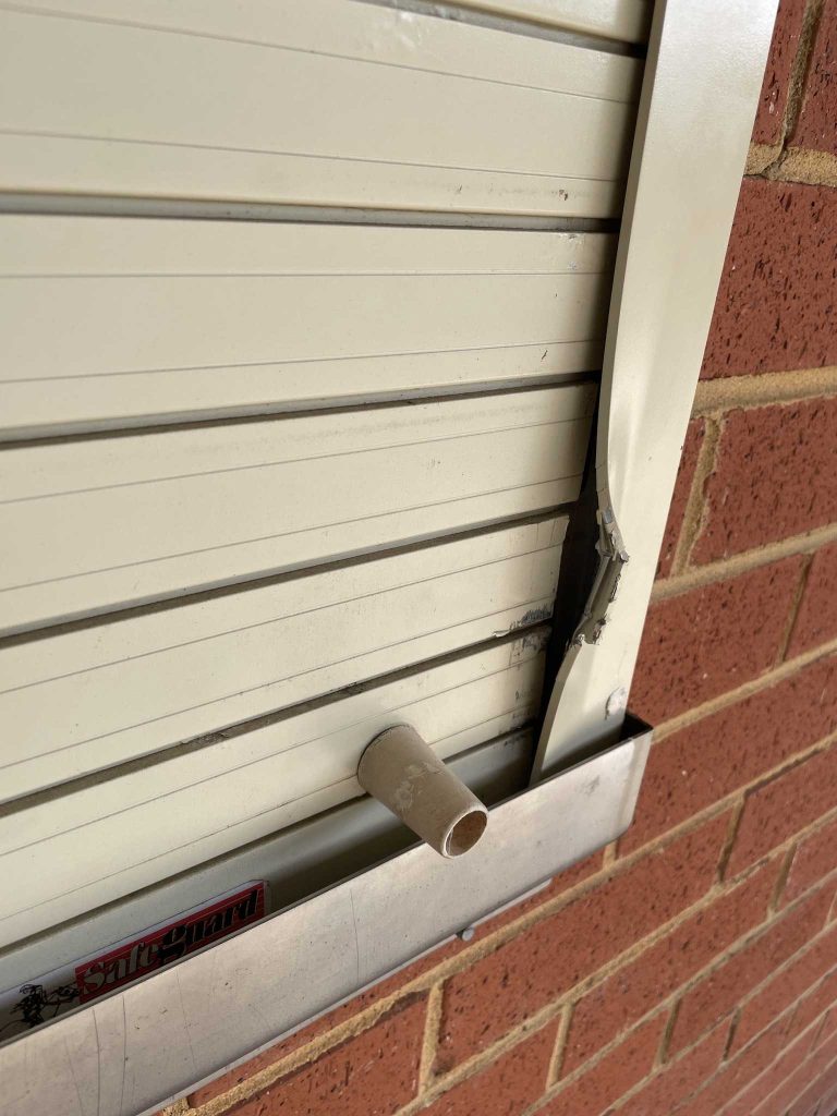 A door damaged during an attempted break-in was repaired by club members.
