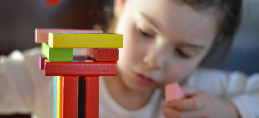 stock photo of child playing with toys.