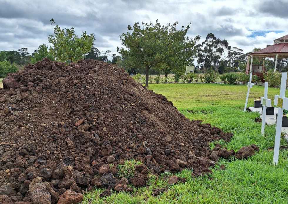 The grave of Cheryl Stewart covered in a mound of mud. Photo / supplied.