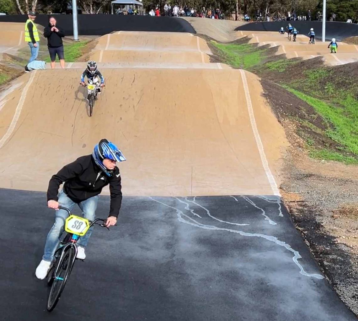 Hume City mayor Naim Kurt pedals to catch up with the leaders on Sunbury BMX Club’s new track. Photo / Steve Hart