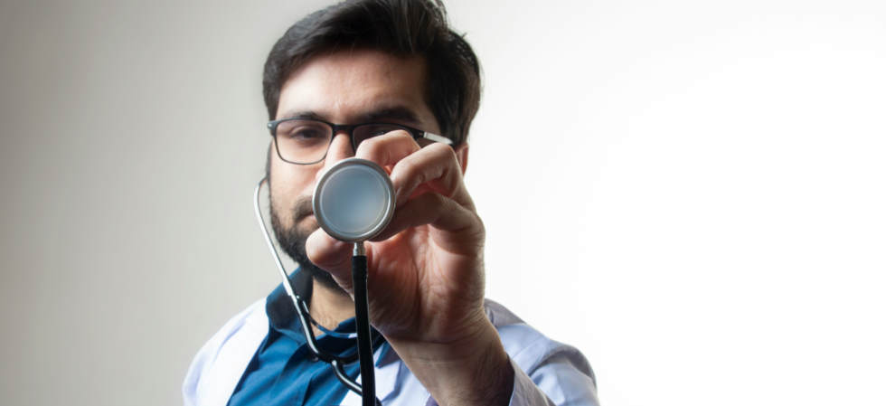 doctor holding a stethoscope.