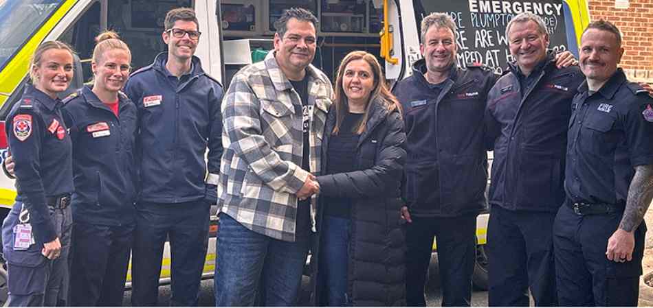 Mr and Mrs Silva with the crew who helped save Mr Silva's life following a heart attack. Photo / Ambulance Victoria.