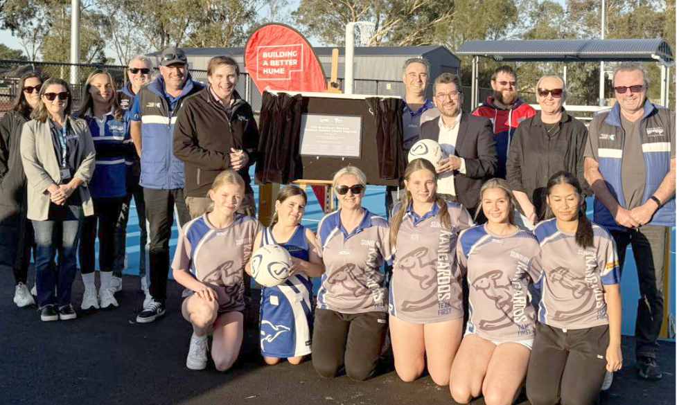Outdoor netball courts officially opened at the Eric Boardman Stadium by Hume City mayor Jarrod Bell (left of sign) and MP Josh Bull. Photo / supplied.